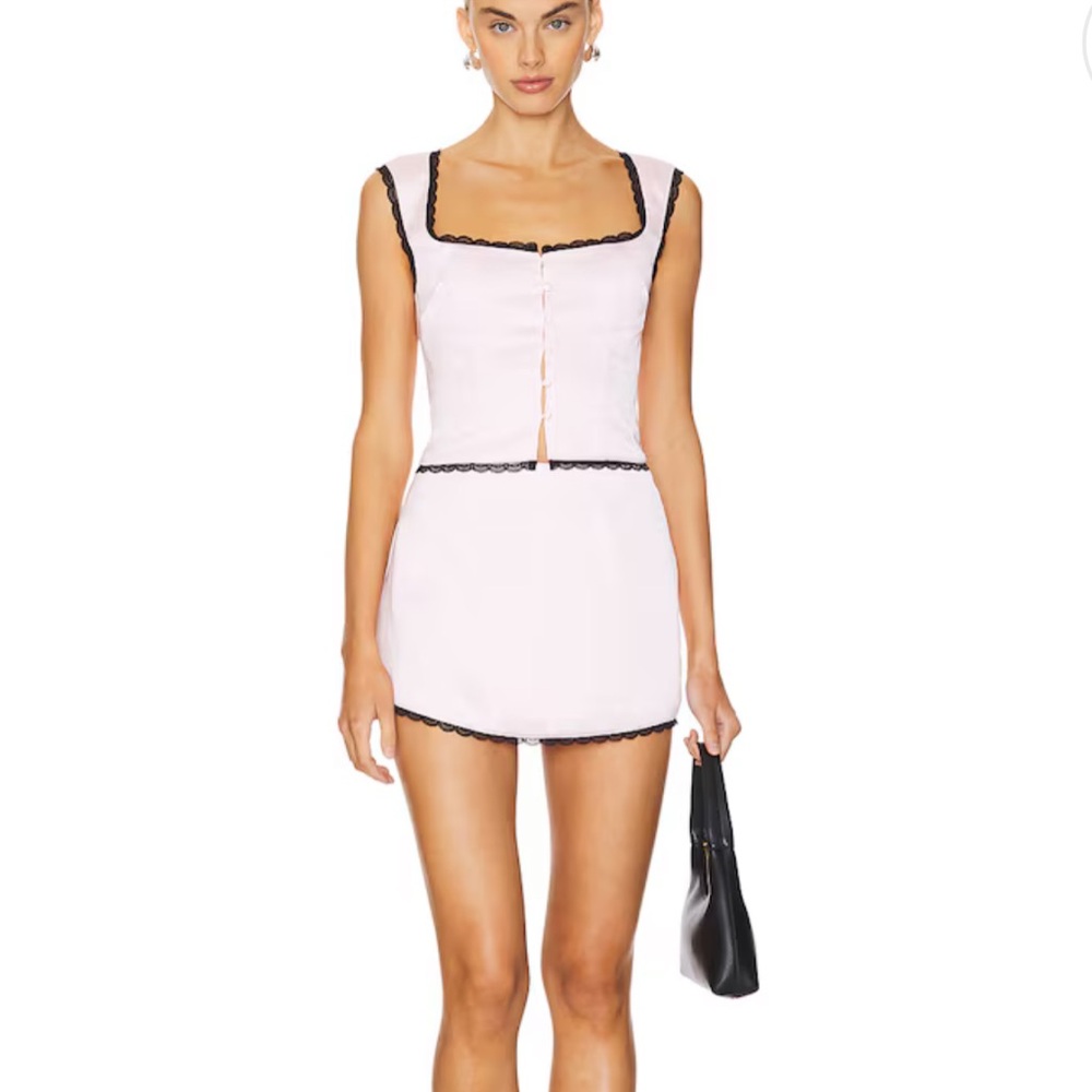 Pink skirt set with black lace trim